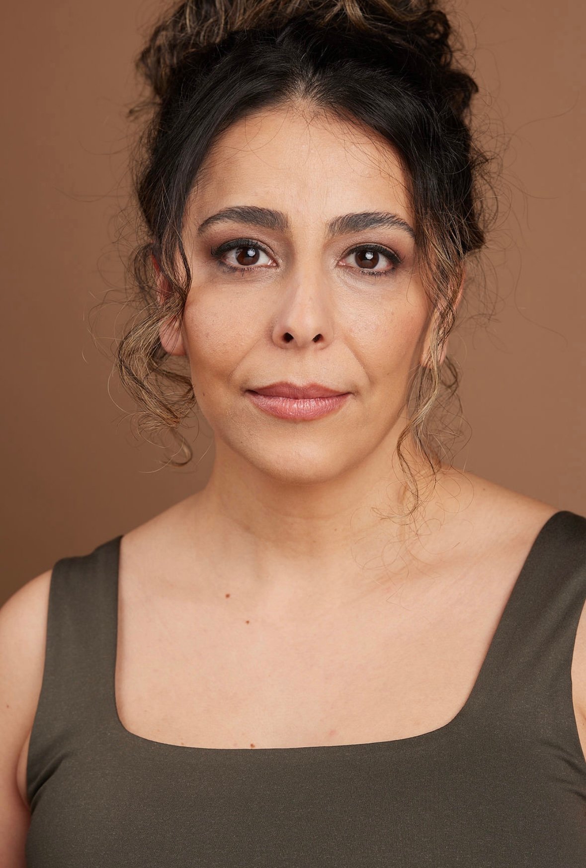 Azadeh Zanjani headshot with hair styled up